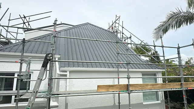 New metal fascia & gutter installed, Kumeu New metal fascia and gutter fitted to a plastered two-storey home with a metal roof during a Taylor fascia conversion in Kumeu, Auckland