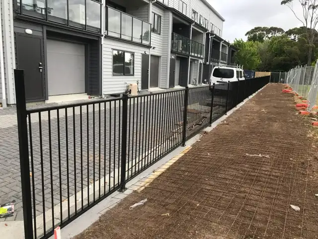 Timber fence build and installation in progress on an Auckland property