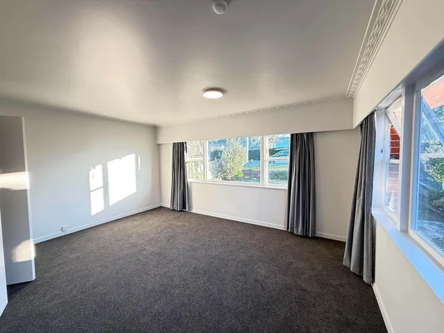 Old carpet uplift in progress during a house carpet replacement in an Auckland home