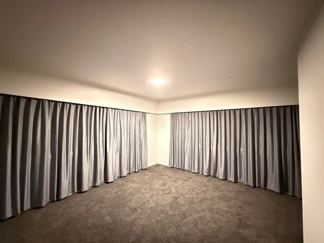 Completed carpet replacement with new carpet and curtains in an Auckland living room