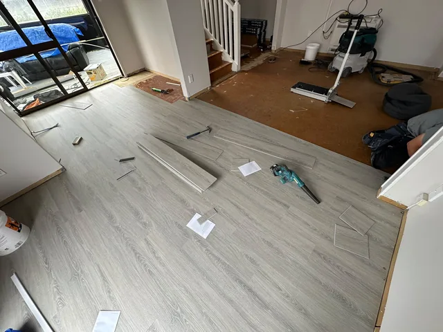 Laminate timber flooring installation in progress on an Auckland property