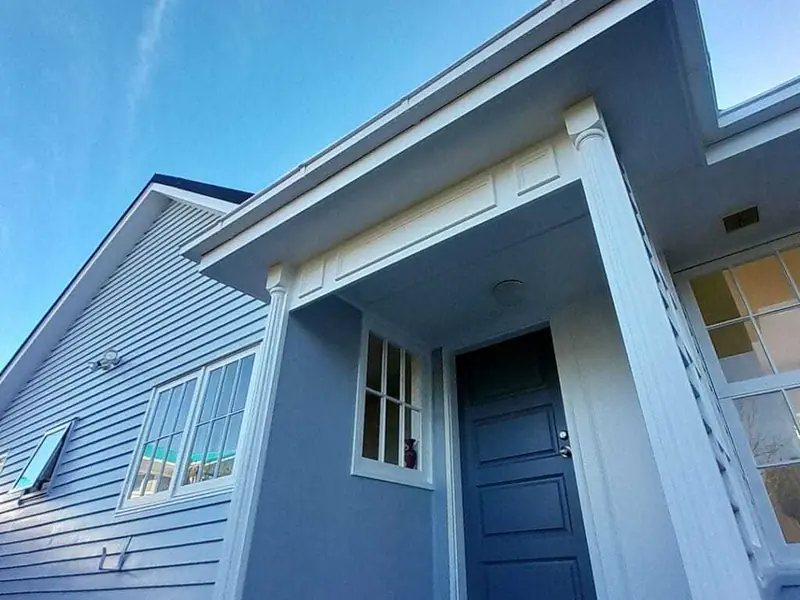 Freshly repainted weatherboard home entrance and porch in Auckland by My Homes Construct Ltd