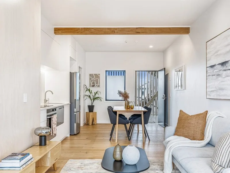 Open-plan living and dining room in a renovated Auckland home by My Homes Construct Ltd